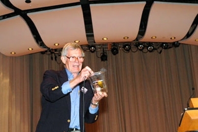 Physics Professor Emeritus John King runs electric current through a pickle, a demonstration he and Institute Professor Emeritus Philip Morrison used in their classes, at a memorial celebration for Morrison at Kresge Auditorium on Saturday, Sept. 10.
