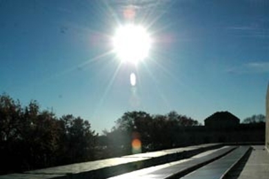 Solar panels on top of the Hayden Memorial Library soak up the afternoon sun on Monday, Nov. 14, the day MIT celebrated the completion of its largest solar installation.
