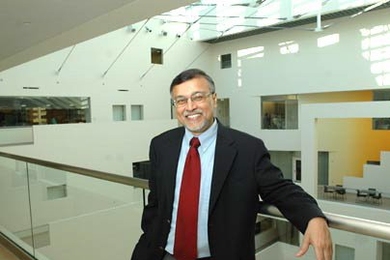Mriganka Sur, head of the Department of Brain and Cognitive Sciences, stands on a balcony overlooking the 90-foot atrium inside the new Brain and Cognitive Sciences Complex, which will be officially dedicated on Friday, Dec. 2.