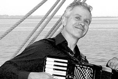Tom Pixton, publishing advisor at MIT, will play the accordian at the Folk Arts Center of New England's New Year's Eve party.
