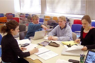 Four participants in the IAP session 'Energy: Science, Technology and Sustainable Development' work on their project. From left are MIT student Jacqueline Brazin; Cynthia Bloomquist, associate director of Corporate Relations, who took part in the class; Lars Appelquist, a graduate student in earth, atmospheric, and planetary sciences; and chemical engineering junior Ruth Misener.
