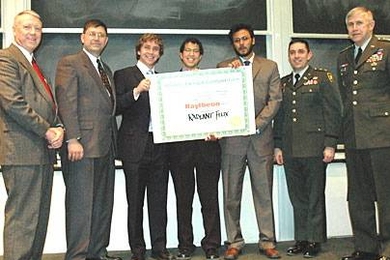 Team Radiant Flux accepts its award for winning the Soldier Design Competition at MIT on Wednesday, March 1. Team members holding the certificate are, from left, Justin Holland, Gary Long and Chandan Das. They are flanked by Institute for Soldier Nanotechnologies (ISN) Director Ned Thomas, far left, standing next to MIT competition coordinator Kurt Keville and Gen. Benjamin Griffin far right, stan...