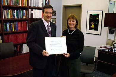 Assistant Professor Vladimir Stojanovic is congratulated on his Doherty Professorship by Alice Gast, vice president for research and associate provost.