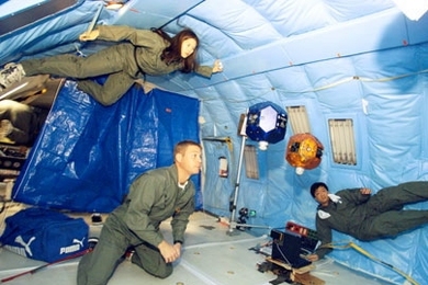 MIT's SPHERES mini satellites rocketed into space on Monday, April 24, en route to the International Space Station. The SPHERES team tested the satellites in 2004 aboard a NASA plane used to simulate weightlessness. From left are team members Stephanie Chen, Steve Sell and Edmund Kong.