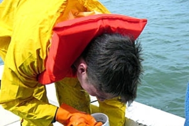 Civil and environmental engineering senior James Vanzo draws water samples from Lake Pontchartrain, which borders New Orleans, during spring break. Vanzo was one of eight undergraduates who conducted research on water quality as part of Laboratory Course 1.107.