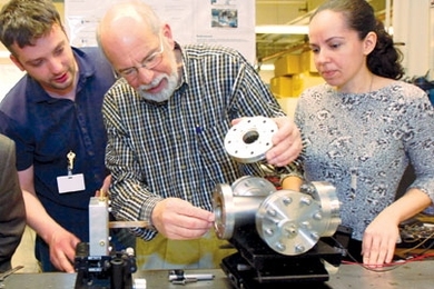 Professor John Kassakian examines a thermophotovoltaic device late last month with, from left, doctoral students Ivan Celanovic and Natalija Jovanovic.