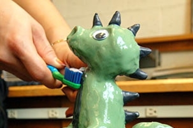 'Flosszilla,' created in Toy Product Design seminar, squirts toothpaste from its mouth and dispenses floss from its tail.