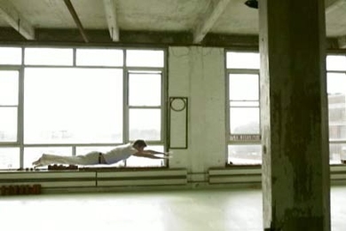 New York-based sculptor and video artist Chris Doyle appears in a Superman pose in his Brooklyn studio in 'Flight,' one of several Doyle videos now on view at the Media Test Wall in Building 56. The finished work retains a jerky motion, which is a clue to Doyle's methodology: The artist performed 230 individual leaps and then sequenced still photographs to depict flight. Through Tuesday, May 30.