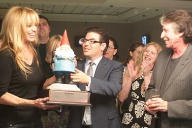 MIT alumnus Edward R. Miller, center, hosts a celebrity poker tournament during his appearance on the television show 'Queer Eye for the Straight Guy.' He is flanked by celebrities Susan Anton and David Brenner in this still from the show, which will air Tuesday, June 20, at 10 p.m.
