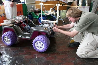 Jonathan Kush of the Alabama School of Mathematics and Science tinkers with his team's anti-mine robot system. To research their project, the nine team members visited the humanitarian demining training center at Fort Leonard Wood, Mo.