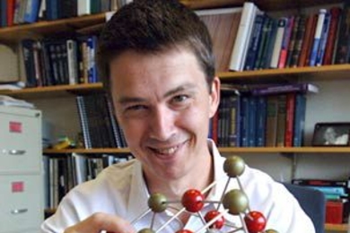 Professor Gerbrand Ceder holds up a model of a perovskite crystal. Ceder and his team of researchers have used data about such crystals to come up with a method for predicting the structure of materials.