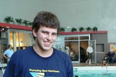 Max Mitchell of Las Vegas holds his team's entry in the underwater robot competition held in the Alumni Pool on July 28, the finale of this year's MITES program. His team, Los Pepos, won the underwater Quidditch match, but not the overall robot competition. <a onclick="MM_openBrWindow('mites1-enlarged.html','','width=509, height=583')">
<span onmouseover="this.className='cursorChange';">Open imag...