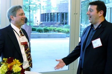 Dean Calcagni, HST advisory council member, left, chats with Sean McKee, Pharma Biosante, at the 5th annual BioBash.