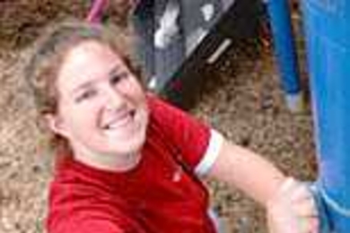 Freshman Tish Scolnik scrubs a jungle gym as part of the CityDays playground clean-up effort in Cambridge.