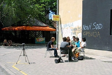 Architecture graduate student Azra Aksamija and organizers of the Lost Highway Expedition are interviewed by fellow travelers in front of Kuda.org in Novi Sad, Serbia.
