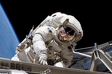 NASA mission specialist Heidemarie Stefanyshyn-Piper pauses for a moment during her Sept. 12 spacewalk, during which she assembled a major truss segment of the International Space Station.