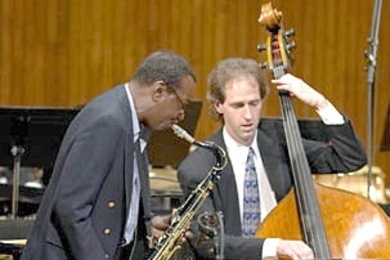 Saxophone great Arni Cheatham, left, performed at MIT with John Funkhouser in 'Beyond: An Ellington Commemoration' in 2004. Cheatham returns Nov. 18 to play with the Festival Jazz Ensemble.