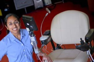 Marshall winner Finale Doshi sits beside a wheelchair equipped with a voice-activated command system she designed.