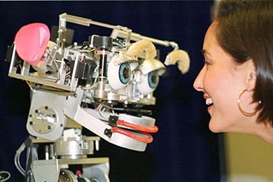 Cynthia Breazeal, MIT Media Lab, faces Kismet, a robot that mimics emotion. This photo is from 2000. <a onclick="MM_openBrWindow('coveney-kismet-enlarged.html','','width=509, height=583')">
<span onmouseover="this.className='cursorChange';">Open image gallery</span>
</a>
<noscript> <a href="coveney-kismet-enlarged.html">
<em>(no JavaScript)</em>
</a>
</noscript>