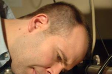 Postdoc Peter Rakich worked with MIT colleagues to develp a novel way to add the power and speed of light waves to traditional electronics.