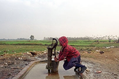 A team of eight MIT students and their advisor, Susan Murcott, brought their ingenuity and technical skills to villages in Nepal in 2002 to try to solve a very basic practical problem--the need for clean drinking water at very low cost. Here, a young girl pumps water from a well outside Lumbini, Nepal.
 <a onclick="MM_openBrWindow('nepal-girl-well-enlarged.html','','width=509, height=583')">
<sp...