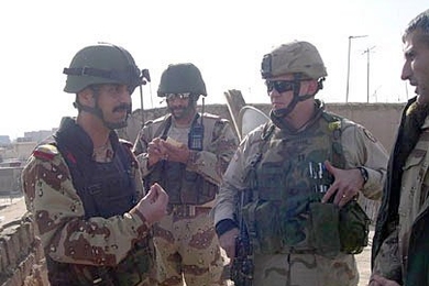 Nathan Minami, far right, conferring with Iraqi Army Officers prior to January 2005 National Elections.