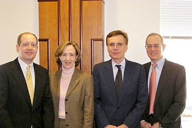 Glenn Ellison, left, President Susan Hockfield, Gregory K. Palm, and Provost Rafael Reif celebrate Ellison's appointment.