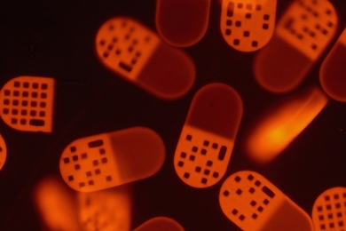 MIT researchers have developed a high-throughput method for the detection of biomolecules (such as DNA shown here) using multifunctional particles. The technique could make medical diagnostics and drug discovery faster and cheaper.