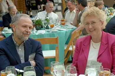 Mechanical engineering professor Triantaphyllos R. Akyls and Senior Associate Dean for Student Life Candace Royer enjoy the luncheon to welcome new members of the Quarter Century Club, held in the Brain And Cognitive Sciences building atrium.