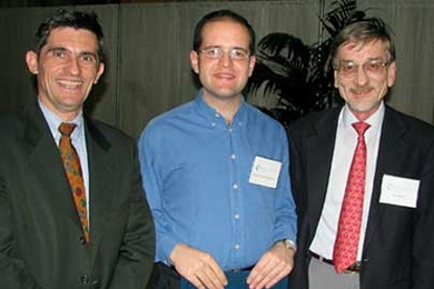Professor Patrick Jaillet (left), head of the Department of Civil and Environmental Engineering, and Professor Ole Madsen (right) of CEE present the Maseeh Award for excellence as a teaching assistant to CEE graduate student David Gonzalez Rodriguez.