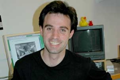 Ben Wood, a second-year graduate student in visual arts in the Department of Architecture, with some of his notes on Diego Rivera's mural "Man at the Crossroads."