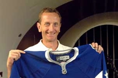 Dr. Kim Blair, an MIT research affiliate in Sports Innovation, holds part of the hockey uniform designed with Reebok for the National Hockey League. Testing in MIT's wind tunnel proved that the prototype reduces the total drag on the player's body by 5 percent.