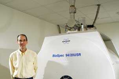 Steven Shannon, operations manager and MR research technologist at MIT, with the 9.4 Tesla MRI machine in the Martinos Imaging Center at the McGovern Institute.