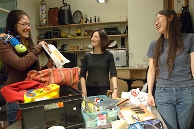 MIT student Lisa Nakano, left, a senior in brain and cognitive sciences; Ruth Rosenholtz, principal research scientist; and graduate student Yuan Zhen laugh at the clutter in an office. The three have identified a way to measure visual clutter.