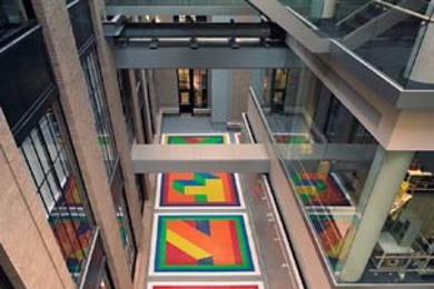 Dazzling colors reflect from Sol LeWitt's 'Bars of Color Within Squares (MIT), 2006' onto both the new Building 6C and Building 8, as seen from Building 4.