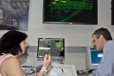 Dan Gabriner, Weston High School math teacher, works with Maria Picardi Kuffner of MIT Lincoln Laboratory's Surveillance Systems group.