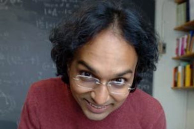 Math professor and crossword puzzle fiend Kiran Kedlaya works on Friday's New York Times puzzle. He will compete in the American Crossword Puzzle Tournament on Feb. 29.