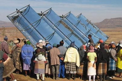 Villagers in Ha Teboho, in the southern African nation of Lesotho, gather to learn about a new concentrating solar generator and hot water system installed by MIT students.
