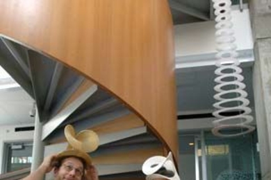 Erik Demaine, left, the Esther and Harold Edgerton Associate Professor of Electrical Engineering, and his father, CSAIL visiting scientist Martin Demaine, model a couple of their sculptures in a Museum of Modern Art show titled 'Design and the Elastic Mind,' which runs until early May.