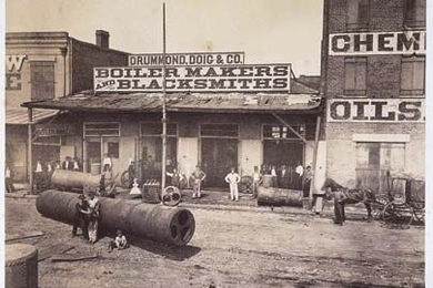 Theodore Lilienthal's photos, examined in a new book by MIT's Gary Van Zante, presented post-war New Orleans businesses as good investment opportunities, bustling yet orderly. Pictured here is the Drummond &amp; Doig Foundry. <a onclick="MM_openBrWindow('nola-boiler-enlarged.html','','width=509, height=583')">
<span onmouseover="this.className='cursorChange';">
<strong>Open image gallery</strong...