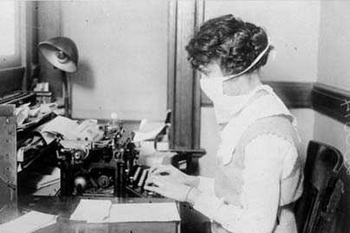 A typist wears a mask in New York during the 'Spanish flu' influenza pandemic of 1918. A new study by MIT graduate student Peter Doshi finds that death rates in pandemic seasons were no higher than--and were sometimes exceeded by--those for severe nonpandemic seasons.