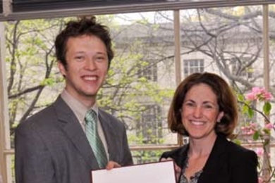 Professor Cynthia Barnhart (Associate Dean for Academic Affairs, School of Engineering) presents Orian Z. Welling, a student in the Department of Mechanical Engineering, with the 2008 Henry Ford Award.
