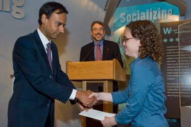 Sarah Finney receives the Carlton E. Tucker Teaching Award announced by associate dept. head Duane S. Boning and handed to her by associate dept. head Srini Devadas.
