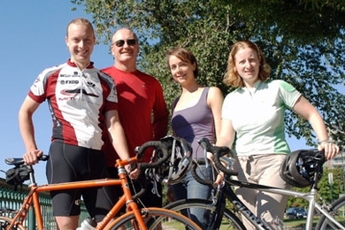 From left, Travis Franck, John Reilly, Valerie Karplus and Noelle Selin, all of the Center for Global Change Science at MIT, pose with their bicycles on Memorial Drive. The four will be part of an MIT group partaking in a ride for climate change awareness from New York City to Washington, D.C.