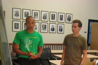 Team Heliotrope demonstrates its sun-tracking technology that won first prize in an MIT competition aimed at developing innovative energy technologies. At left is team member George Whitfield, a graduate student in materials science. His teammate and fellow grad student Vyom Sharma is at right. The third member, Forrest Liau, is not shown. <a onclick="MM_openBrWindow('madmec-4-enlarged.html','','w...