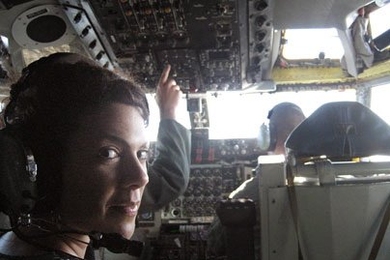 Department of Materials Science Associate Professor Christine Ortiz in the cockpit of an Air Force KC-135 Jet during landing on a Defense Science Study Group trip.