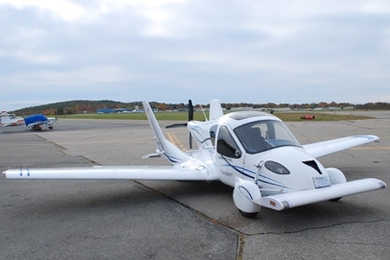 The TransitionÂ® Roadable Light Sport Aircraft Proof of Concept with wings extended at Lawrence Municipal Airport.