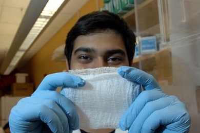 Sophomore Asad Moten holds up a fibrous scaffold he developed that can help regenerate cartilage and other tissues.