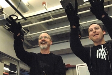 Video artist Bill Viola, left, tries out the 'wall' in the Tangible Bits lab with the help of graduate student Jamie Zigelbaum.
