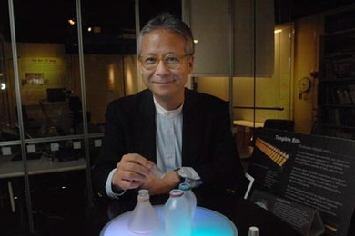 Hiroshi Ishii with one of his early projects, bottles that play music when their stoppers are removed.